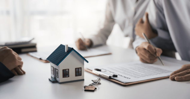 Customer-writing-signing-signature-on-paper-contract-with-real-estate-agent-and-receive-sample-home Customer writing signing signature on paper contract with real estate agent and receive sample home