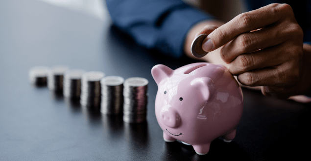 person-putting-money-into-a-piggy-bank-for-savings person putting money into a piggy bank for savings