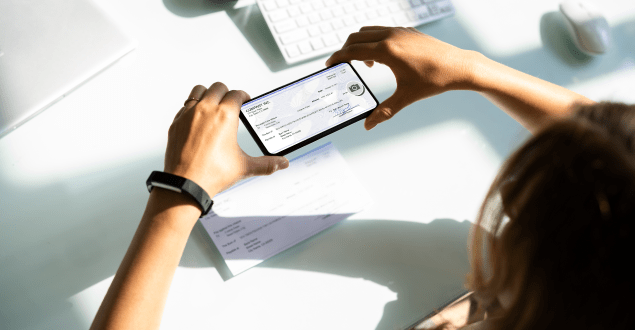 woman-depositing-check-on-mobile-phone person making payment online