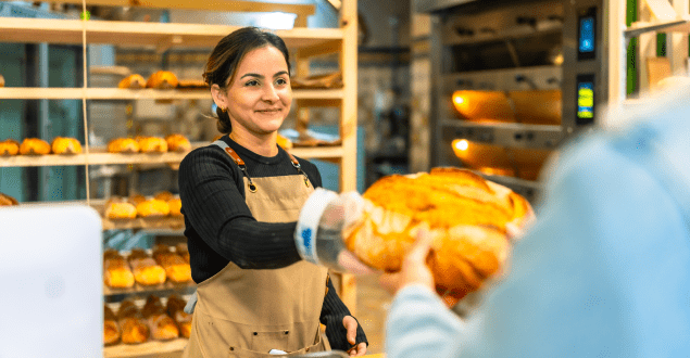 woman-selling-bread-to-a-client-in-an-artisan-bakery group of corporate employees involved in office move