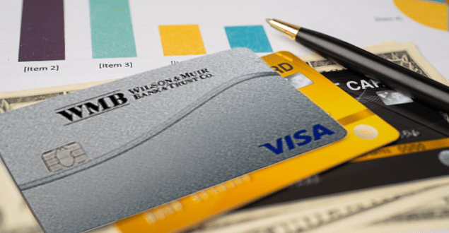 WMB-credit-card-on-chart-and-graph-paper person making payment online